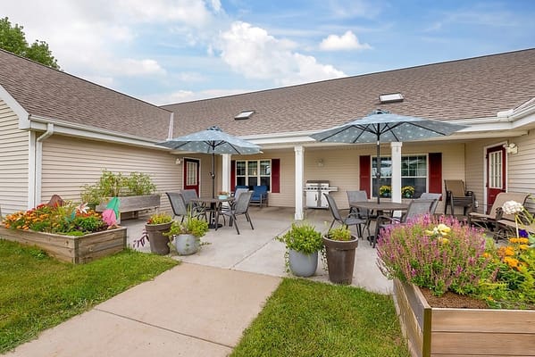 Outdoor patio area with tables and umbrellas