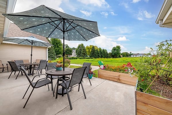 Outdoor patio area with tables and umbrellas