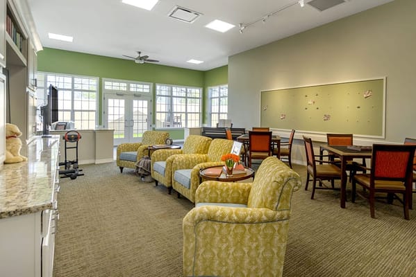 Bright common area with seating and tables