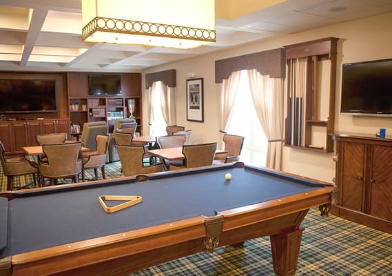 Interior view of a game room with a pool table