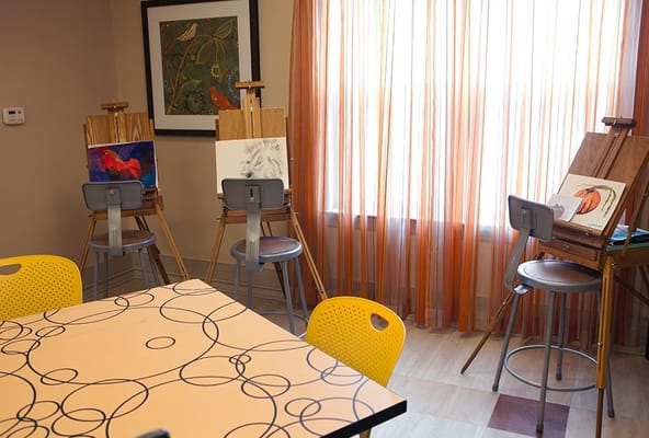 Art easels set up in a creative activity room
