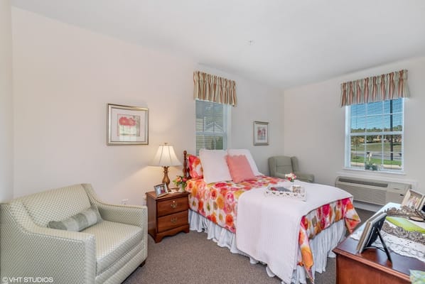 Cozy resident room with floral decor and natural light