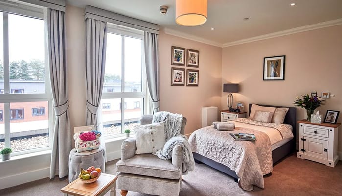 Cozy resident room with bed and seating area