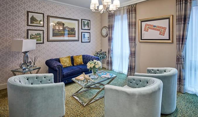 Interior lounge area with chairs and decorative art