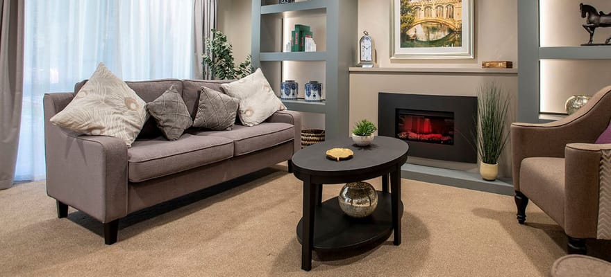 Living room with a sofa, coffee table, and decorative elements