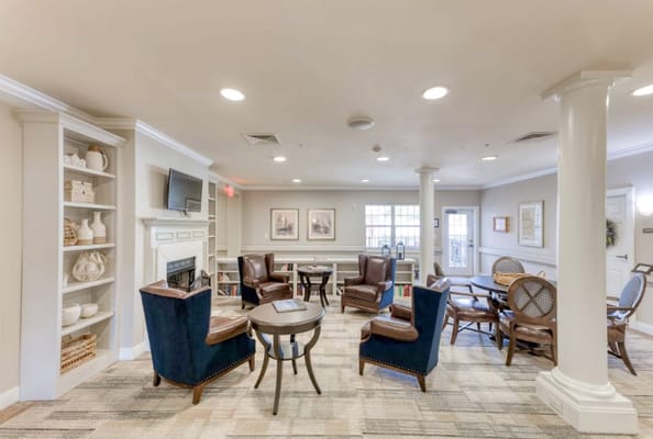 Cozy living room with seating area and bookshelf