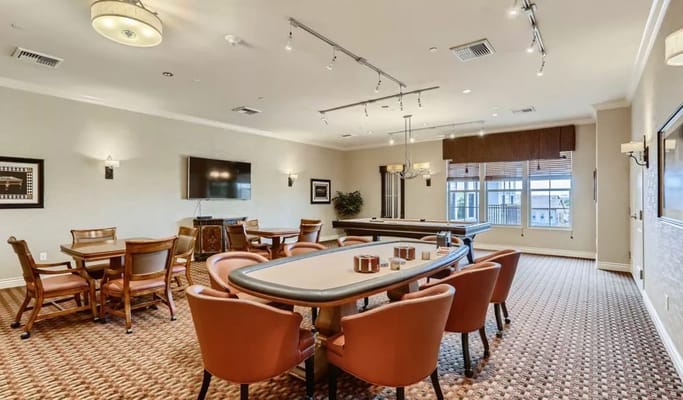 Bright common area with pool table and seating