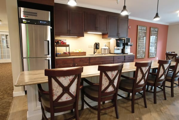 Bright common area with a kitchen and seating