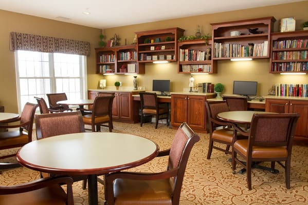 Common area with seating and bookshelves