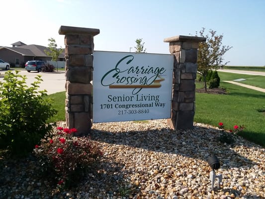 Sign for Carriage Crossing Senior Living on the premises