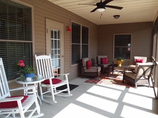A cozy outdoor space with seating and plants