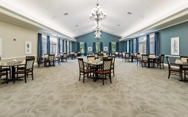 Bright and spacious dining room with tables and chairs