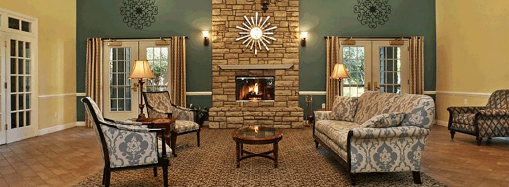 Cozy interior common area with a fireplace and seating