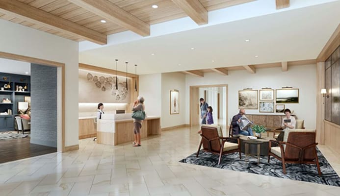 Bright interior common area with residents and staff