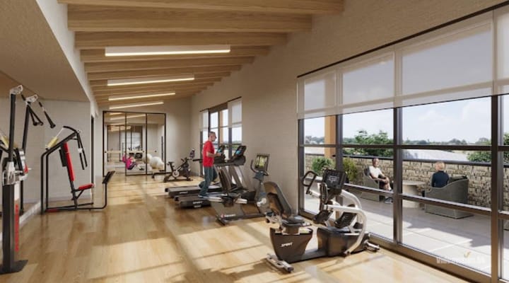Residents exercising in a modern fitness area