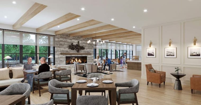 Residents enjoying a cozy common area with a fireplace