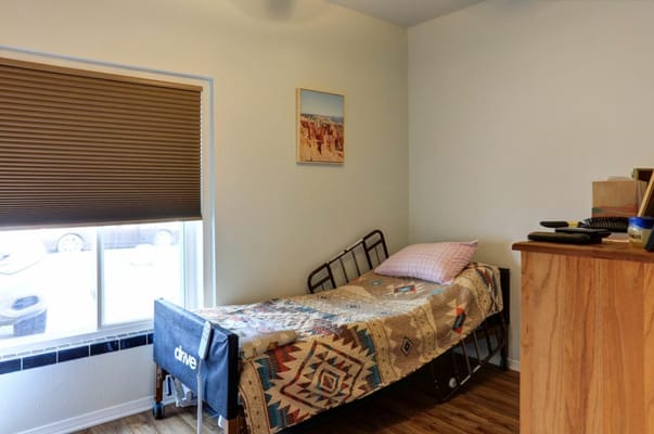 Private resident room with bed and window