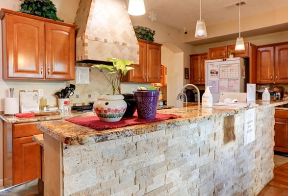 Bright kitchen space with plants and countertops