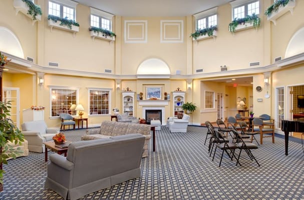 Spacious lounge area with seating and fireplace