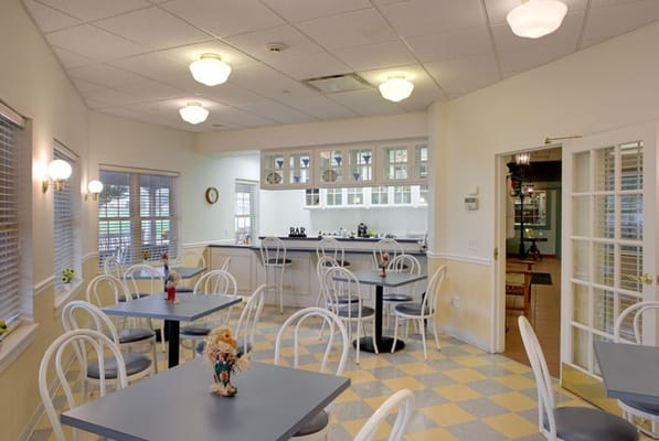 Bright dining area with tables and chairs
