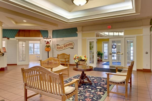 Cozy lobby area with seating and the Soda Shoppe sign