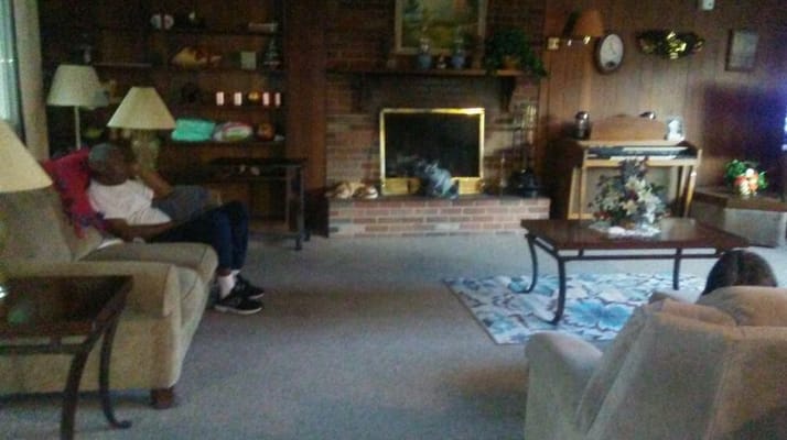 Residents lounging in a cozy common area