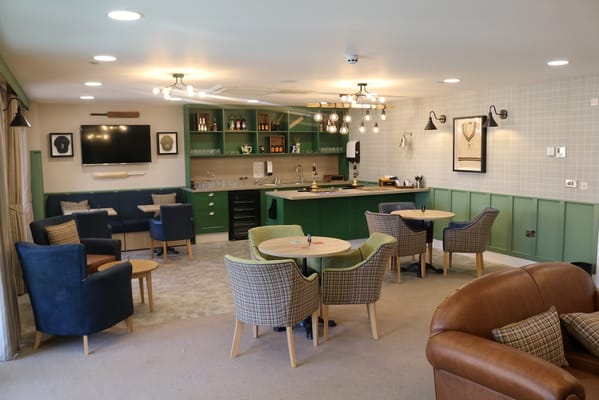 Bright common area with seating and bar facilities