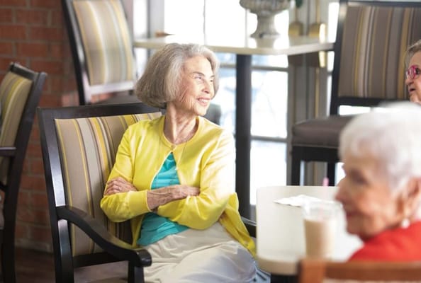 Seniors chatting in a cozy common area