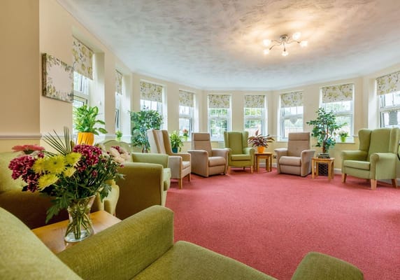Bright common area with seating and plants