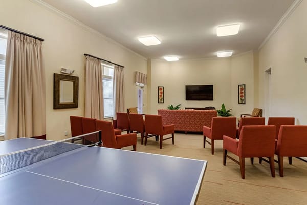 Interior common area with seating and a table tennis table