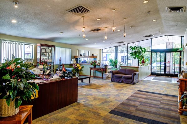 Spacious lobby area with seating and reception desk.