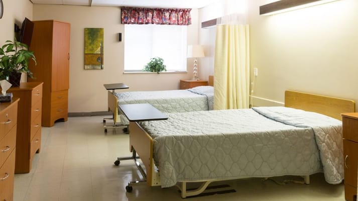 Interior view of a shared resident room with beds