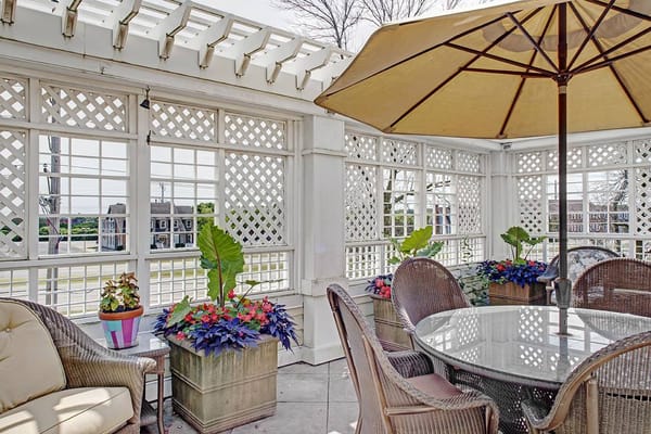 Outdoor patio area with plants and seating