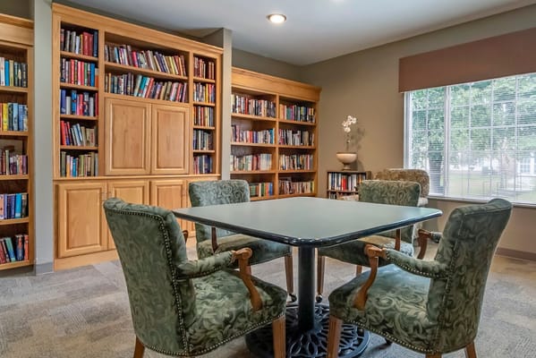 A cozy reading area with bookshelves and seating