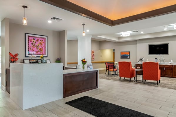 Bright common area with reception desk and seating