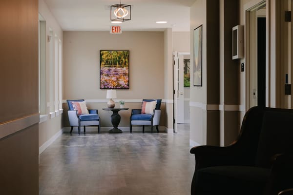 Bright hallway with seating area and artwork
