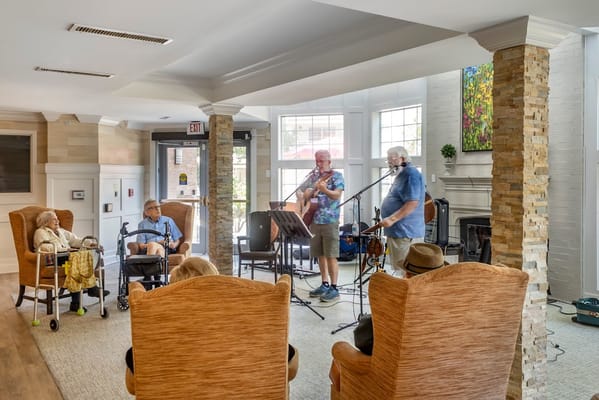Residents enjoying live music performance in a common area