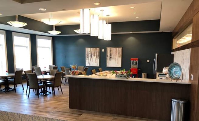 Bright common area with seating and refreshments