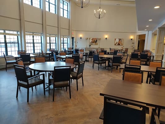 Bright and spacious dining area with tables and chairs