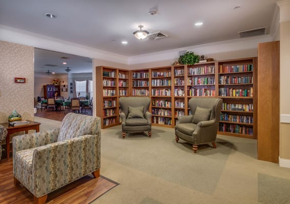 Interior view of a cozy library area with bookshelves