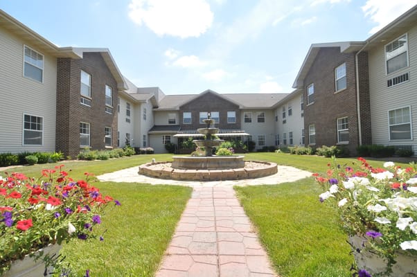 Garden centerpiece with a fountain and flower beds