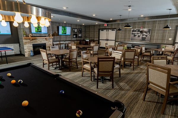 Interior view of the common activity room with tables