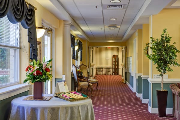 Interior hallway with flowers and seating