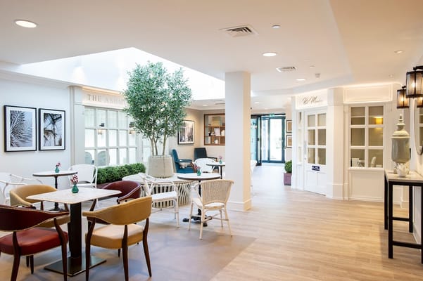 Bright interior common area with seating and plants