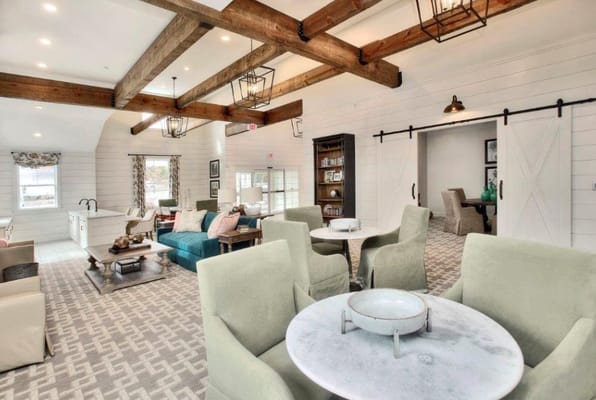 Spacious common area with comfortable seating and wooden beams