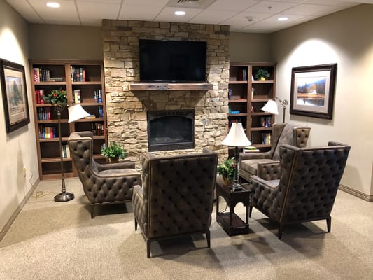 Cozy lounge area with comfortable seating and a fireplace