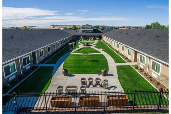 Aerial view of a landscaped outdoor space with seating