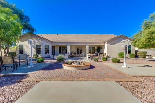 Outdoor patio with seating and desert landscaping
