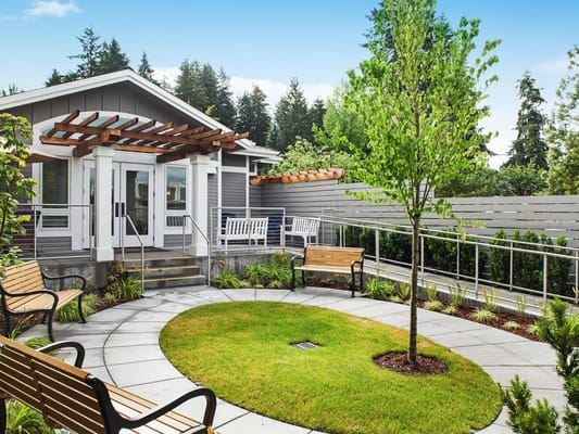 Outdoor space with seating and greenery at the facility