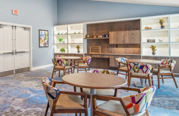 Bright common area with tables and chairs